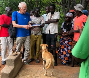 Ian presenting book to Langson's uncle